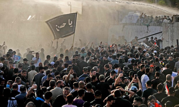 Security forces use a water cannon to prevent supporters of the Coordination Framework from entering Baghdad’s high-security Green Zone