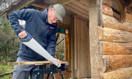 Kevin Rushby building his cabin.