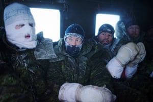 Canadian pilots and air crew seen after a week of Arctic survival training for military personal from Canada, the UK and France at the Canadian Forces Crystal City training facility near Resolute Bay in Nunavut, Canada. These military personnel are in a tracked ground vehicle taking them back to heated facilities after a week of living outdoors in makeshift shelters at temperatures below minus 50 degrees Celsius.