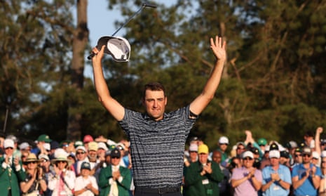 Scottie Scheffler of the U.S. celebrates on the 18th green after winning The Masters.
