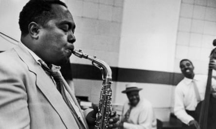 Charlie Parker, jazz musician, playing saxophone.