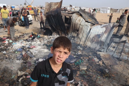 A young boy at the site of an Israeli strike on a camp