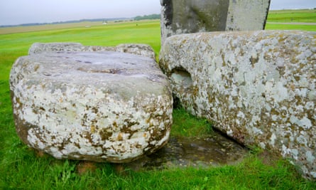 Two fallen stones sit on top of the altar stone