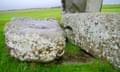 The altar stone lies flat and buried under two fallen sarsen stones and is barely visible to visitors.