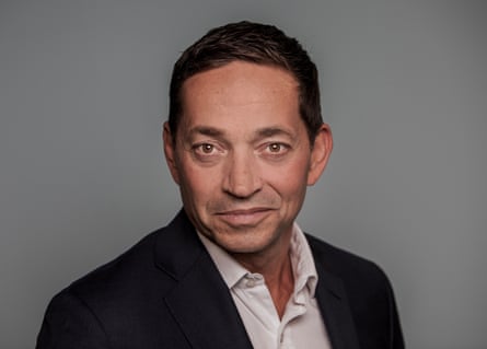 A headshot of Alex Baldock.