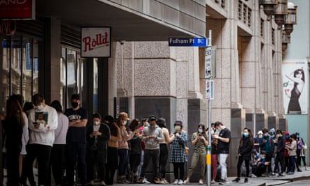 Hundreds of young Melbournians line the footpath of Flinders Lane waiting to secure a free meal and from Tian38.
