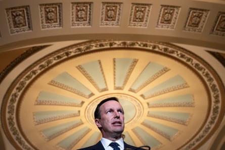 a man beneath an ornamental ceiling