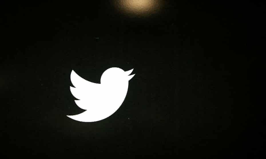 The Twitter bird logo is seen in white on a black background.
