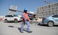 A migrant worker carries a pole at a World Cup construction site in the Qatari capital Doha.