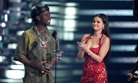 Rema (left) and Selena Gomez accept the award for best Afrobeats for Calm Down at the MTV Video Music Awards 2023.