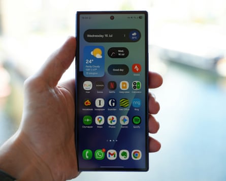 The Samsung Galaxy Z Fold 7 held shut in a hand showing the home screen.