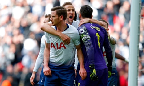 Tottenham Hotspur’s Harry Kane (centre) celebrates with Jan Vertonghen (left) and keeper Hugo Lloris after he saved a penalty from Aubameyang.