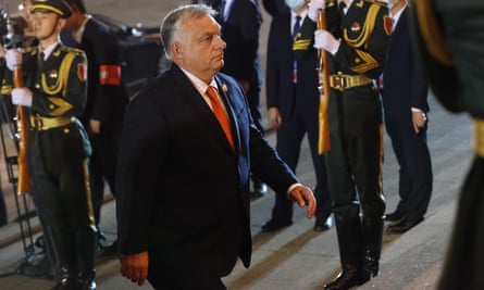 Viktor Orbán is seen arriving at the congress centre with Chinese military personnel in ceremonial dress standing to attention to welcome him