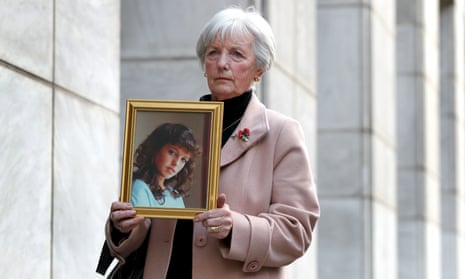 Marie McCourt holds a picture of her daughter Helen, murdered in 1988