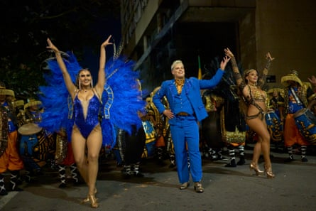 Performers from the Lonjas de Ciudad Vieja comparsa dance to candombe music during the Corso de la Ciudad Vieja in Montevideo.