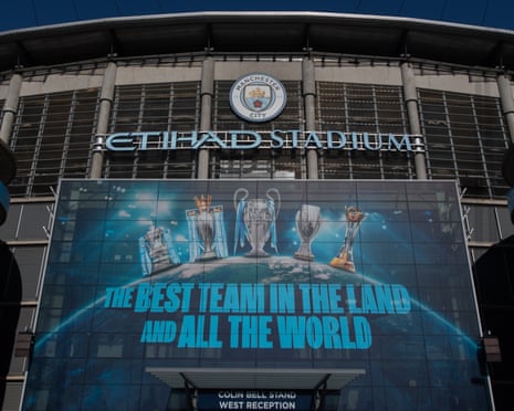 A general view outside the Etihad Stadium with a banner of the list of trophies won by Manchester City and text that reads: âÂÂThe best team in the land and all the worldâÂÂ
