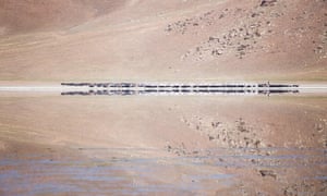 ‘A herd of goats and sheep move near a salt lake near Moron in northern Mongolia. Their reflection is captured in the water with near-perfect symmetry.’