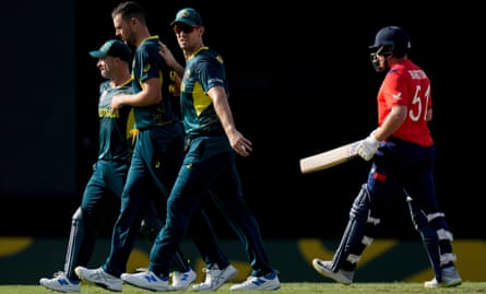 Australia's captain, Mitchell Marsh, pats Josh Hazlewood after he took the wicket of England's Jonny Bairstow.