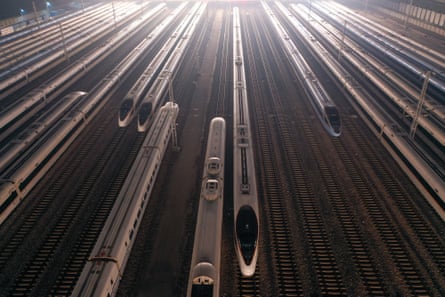 Bullet trains wait on the storage tracks of Nanjing South Railway Station before the rush hour.