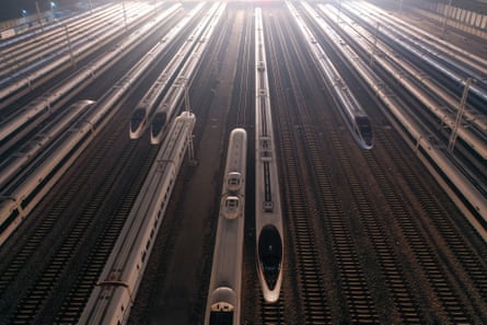 Bullet trains waiting on storage tracks at Nanjing South Railway Station ahead of the travel rush