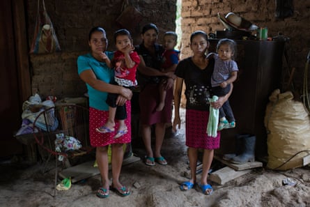 Juana Carranza, 31, holds her daughter Santos Griselda, 3; Silvia Pérez, 27, holds her son Elzer, 2; and María Elena Reyes, 36, holds her daughter Doren, 18 months.