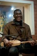 Bassekou Kouyate, one of the biggest names in west African music, plays the kora in a Bamako recording studio.