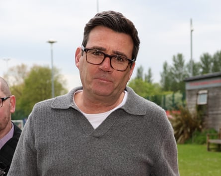 Andy Burnham in a grey sweater and white t-shirt
