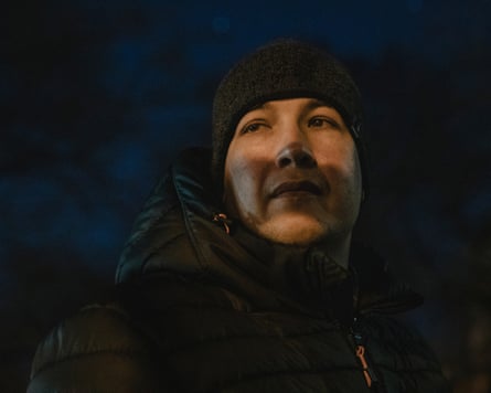 Man in a puffer jacket and beanie cap