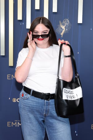 Megan Stalter is super casual in a white t-shirt, tennis bracelet and jeans, but the message on her purse ‘Ceasefire now!’ is anything but