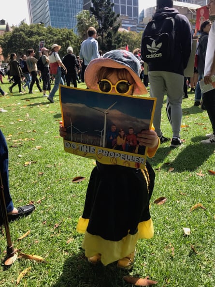 Three-year-old holding a sign at the climate strike