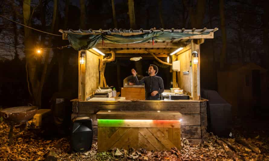 Gino Scrigna making pizza in the woods