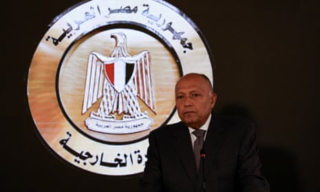 Egyptian Foreign Minister Sameh Shoukry looks on as he speaks to the media.