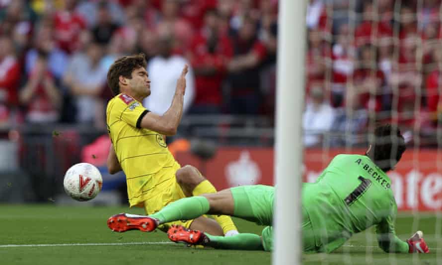 Liverpool’s goalkeeper Alisson blocks a shot from Chelsea’s Marcos Alonso.