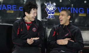 Aymen Tahar on the Sheffield United bench with Sun Jihai in 2009.