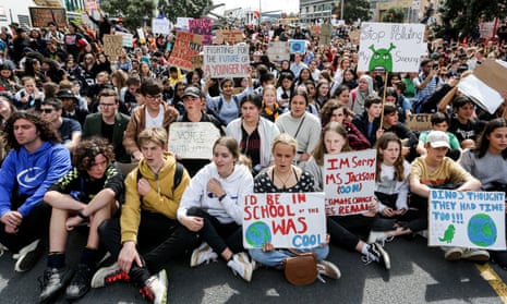 Climate change supporters march down Queen Street to Quay Street in Auckland