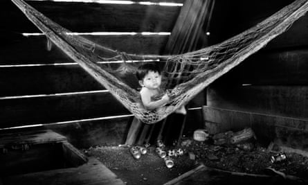 A baby alone in a hammock, Puerto Barrios, Guatemala