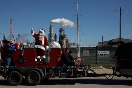 The annual town Christmas parade, organized by the local Catholic church and sponsored by Valero, takes place in the Manchester neighborhood in industrial east Houston, Texas.