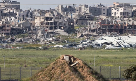 Picture taken from Israel's southern border with the Gaza Strip shows buildings destroyed by Israeli bombardment on 26 March 2024.