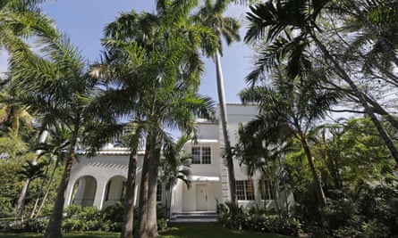 white mansion with palm trees