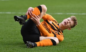 Keane Lewis-Potter of Hull City is tackled by Adam Thompson of Rotherham United resulting in a red card.