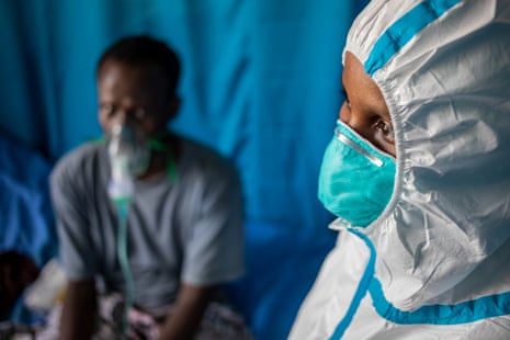 A healthcare worker and patient in the intensive care unit at De Martini hospital.