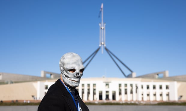 Extinction Rebellion climate activists gather outside Parliament House in Canberra in July.