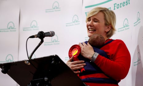 Stella Creasy carries her baby daughter as she celebrates winning in Britain's 2019 general election in Waltham Forest Town Hall.