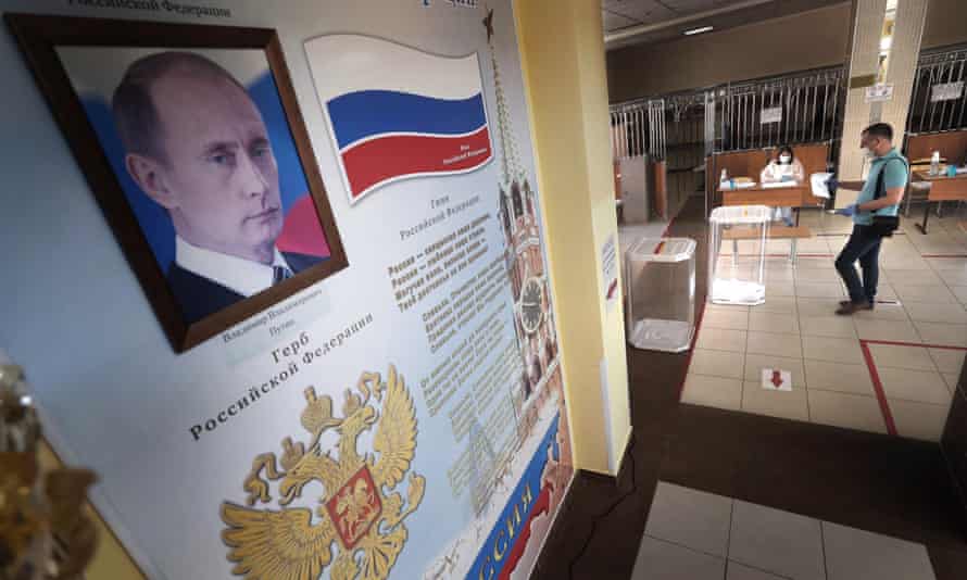 A portrait of Vladimir Putin at a polling station in Moscow