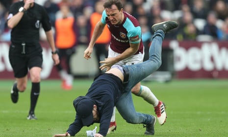 Mark Noble and a West Ham pitch invader