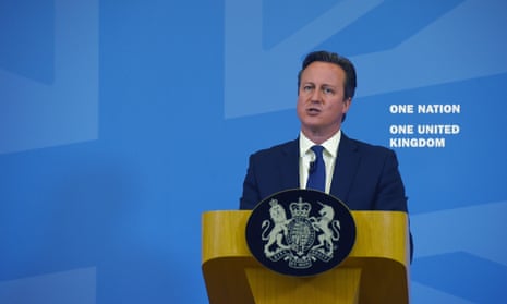 David Cameron standing at a podium
