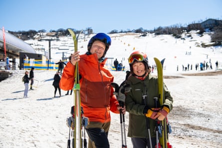 Glen Clark and partner Masumi Ueda leave the slopes after some runs on the man-made snow at Perisher Blue Ski Resort in NSW.