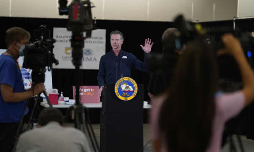 Gavin Newsom takes questions from the media on the day he received his vaccine.