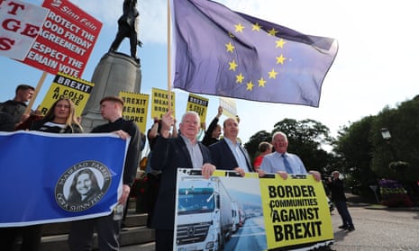 Border Communities Against Brexit members protest in Belfast during Boris Johnson’s visit on 31 July.