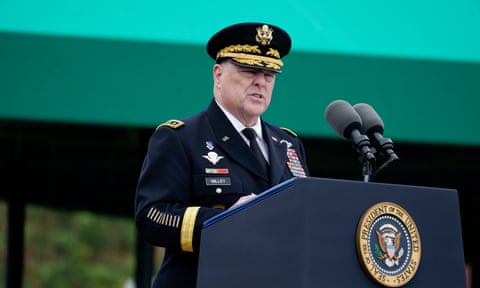 man in military uniform speaks into microphone
